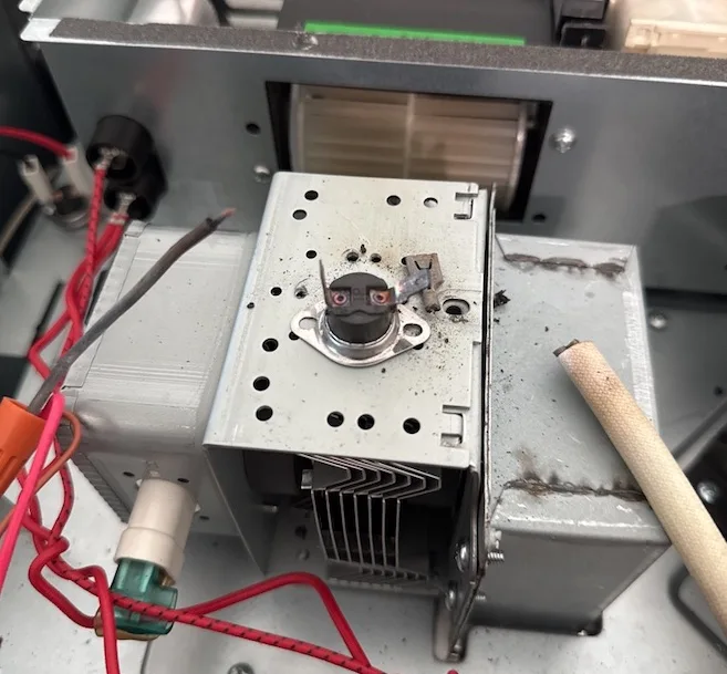 Internal microwave components exposed during professional diagnosis