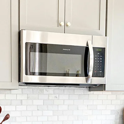 Stainless steel over-the-range microwave in a home kitchen