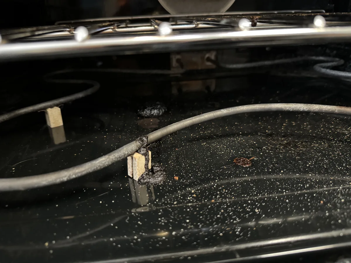 Broken bake heating element inside an electric oven