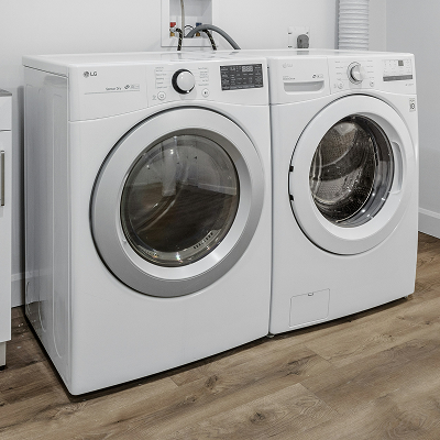 Front-load washer and dryer in a laundry room